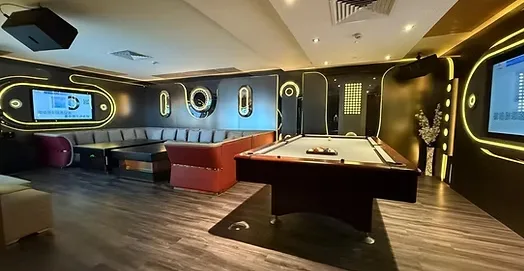 Iconic KTV VIP room in Parklane Singapore — pool table, wraparound booth seating and 100-inch screens